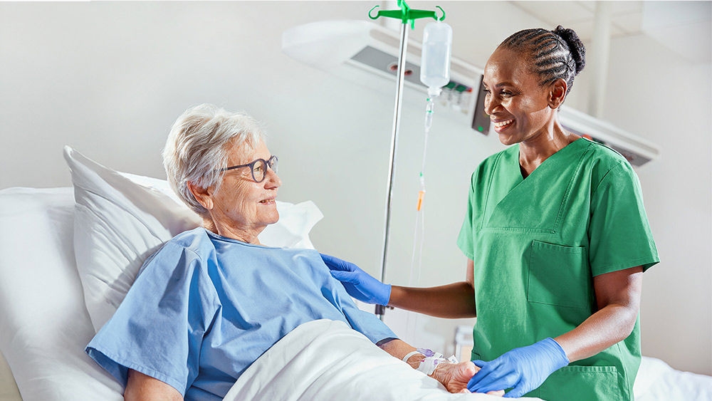 Healthcare professional assisting a patient during IV therapy